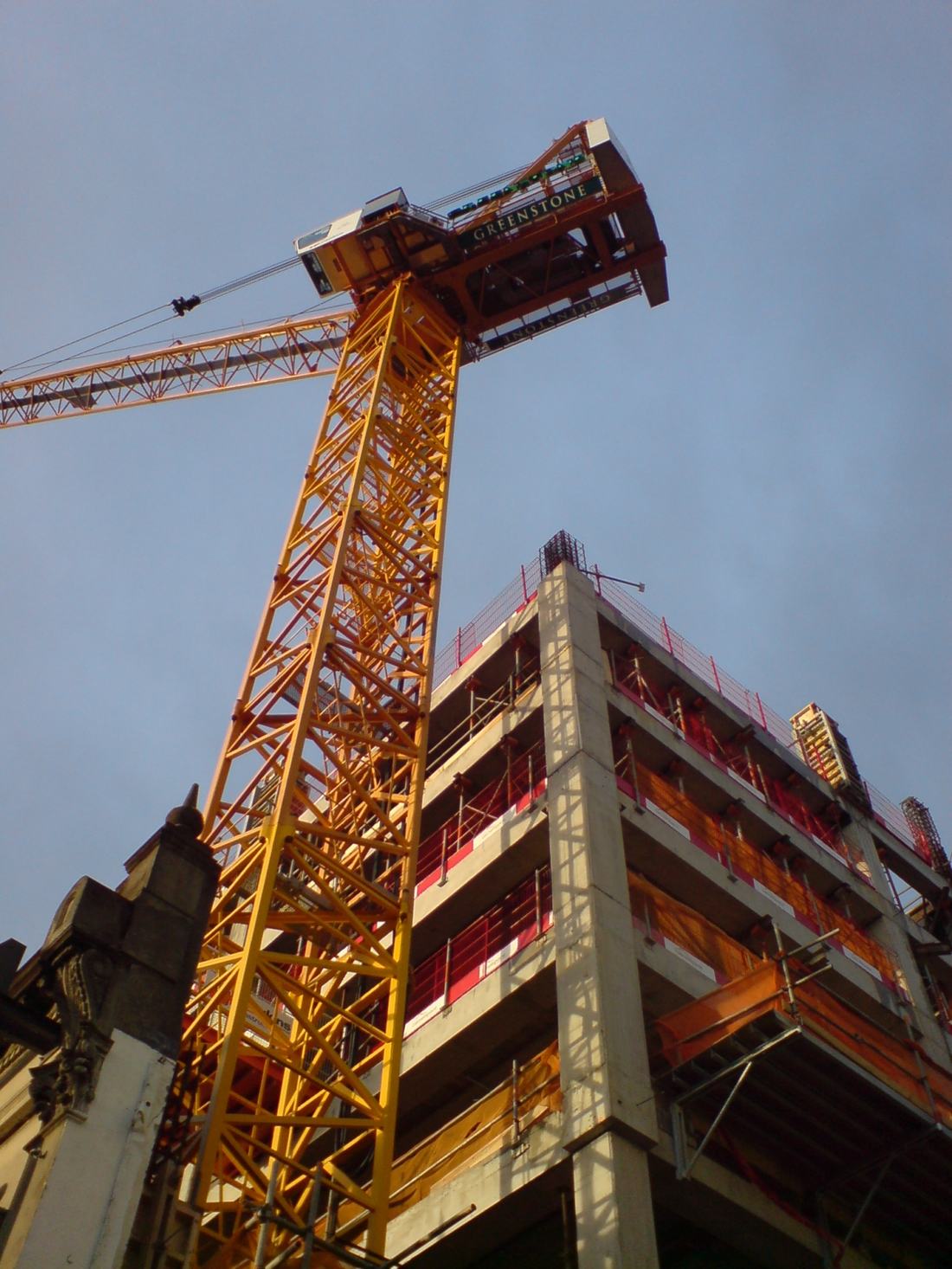 A crane over a residential building under construction